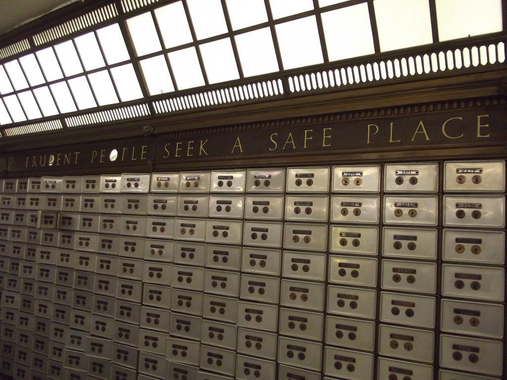 Rows of safe deposit boxes in a bank vault