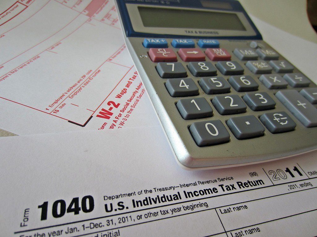 A calculator on top of a US 1040 tax form