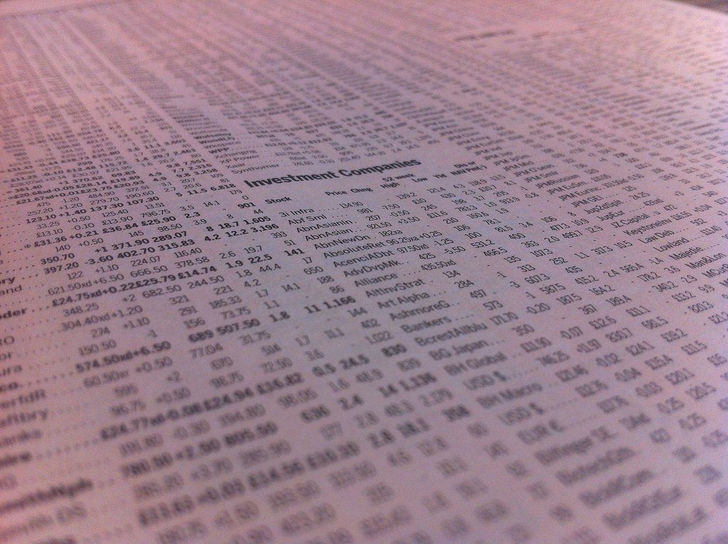 Close-up of printed stock price listings in a newspaper