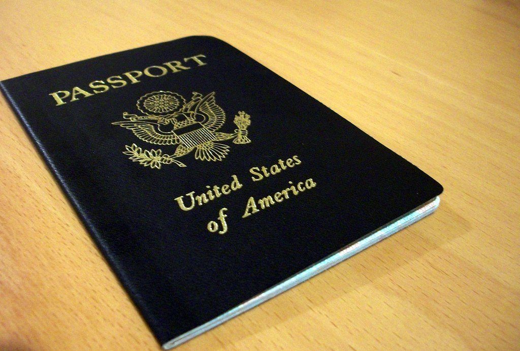 A passport lying on a desk