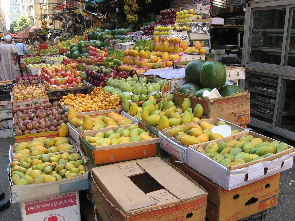 A market stall piled with fresh fruit